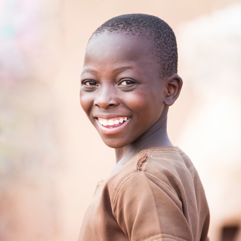 african kid turning and smiling