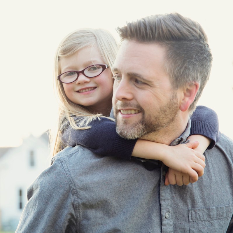 little girl on dads back