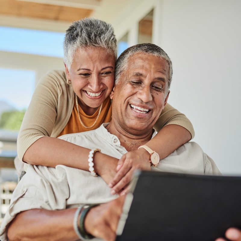 Tablet, retirement and senior couple on outdoor patio reading website for online quote, wealth and asset management research. Elderly, senior people happy with digital app life insurance information